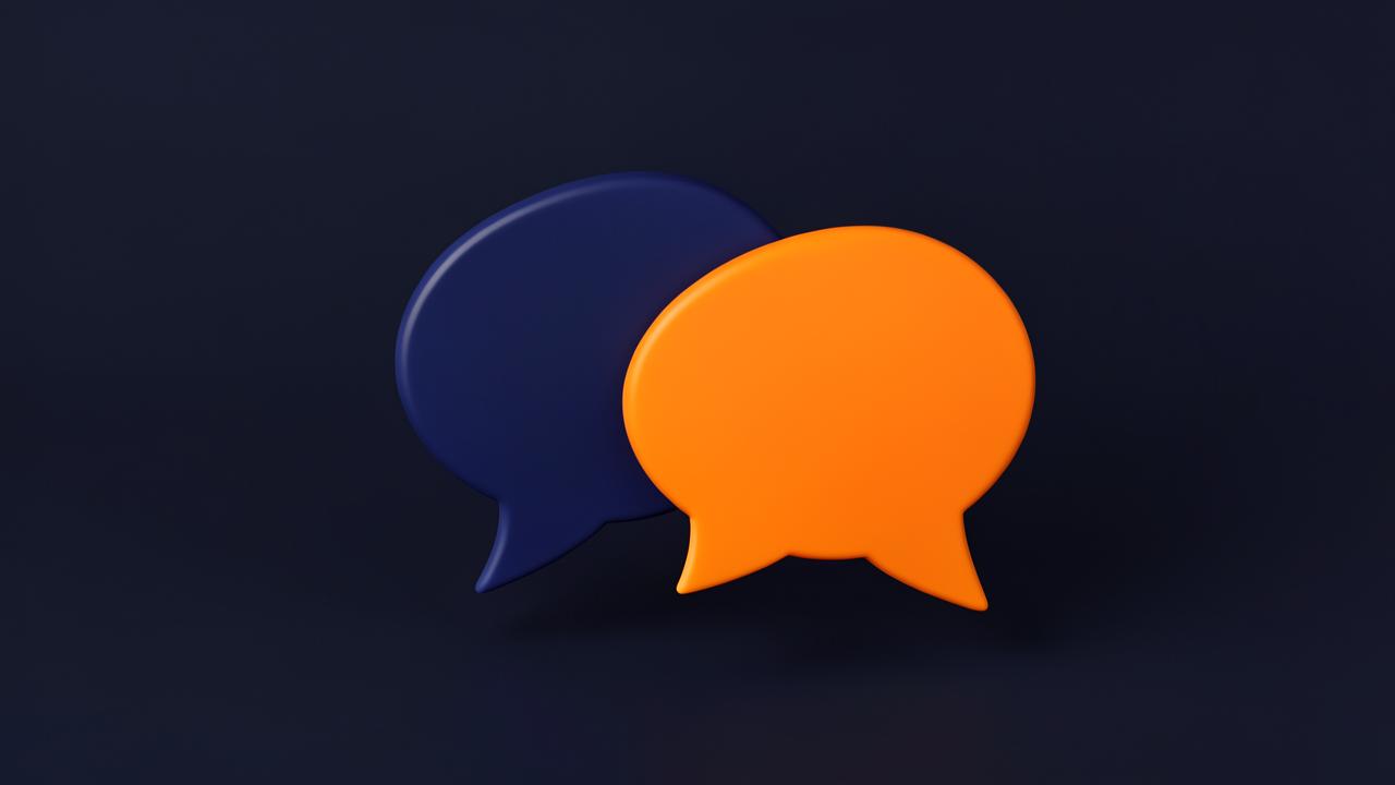 Two speech-bubble forms in navy and orange meeting at an angle on a plain background